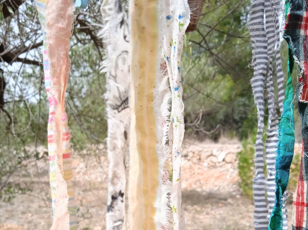 Homemade fabric ribbons drying in the sun