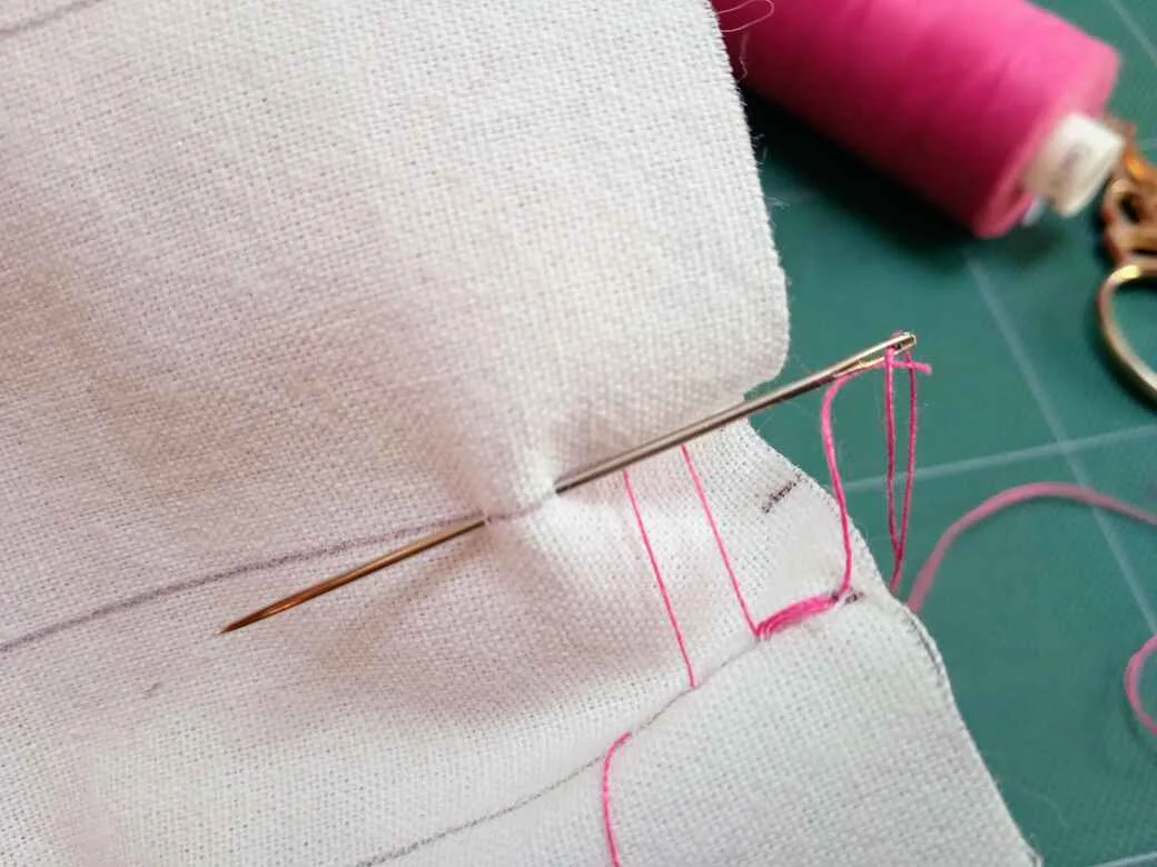 How to sew ladder stitch - Step 3: alternate stitches form ladder structure with thread.