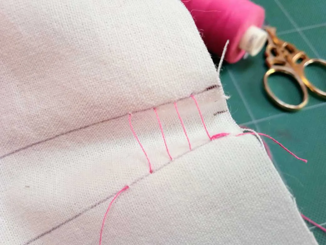 How to sew ladder stitch - Step 4: Continue to make alternate stitches and start to tighten the thread to pull together the top and bottom lines.