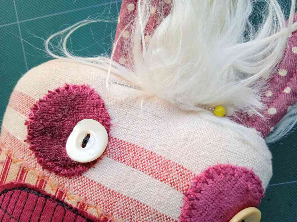 pin hair in place on doll