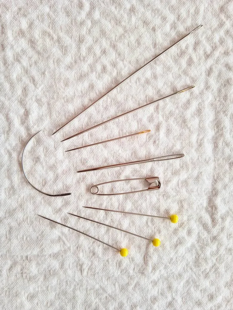 A selection of sewing needles and pins