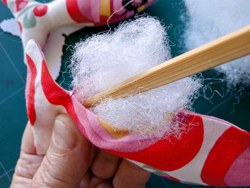 Stuffing Fishy Doll with Polyester fibre.