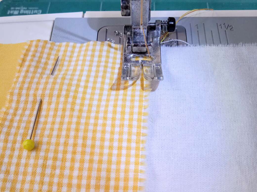 Top stitch fabric pieces together using a sewing machine.