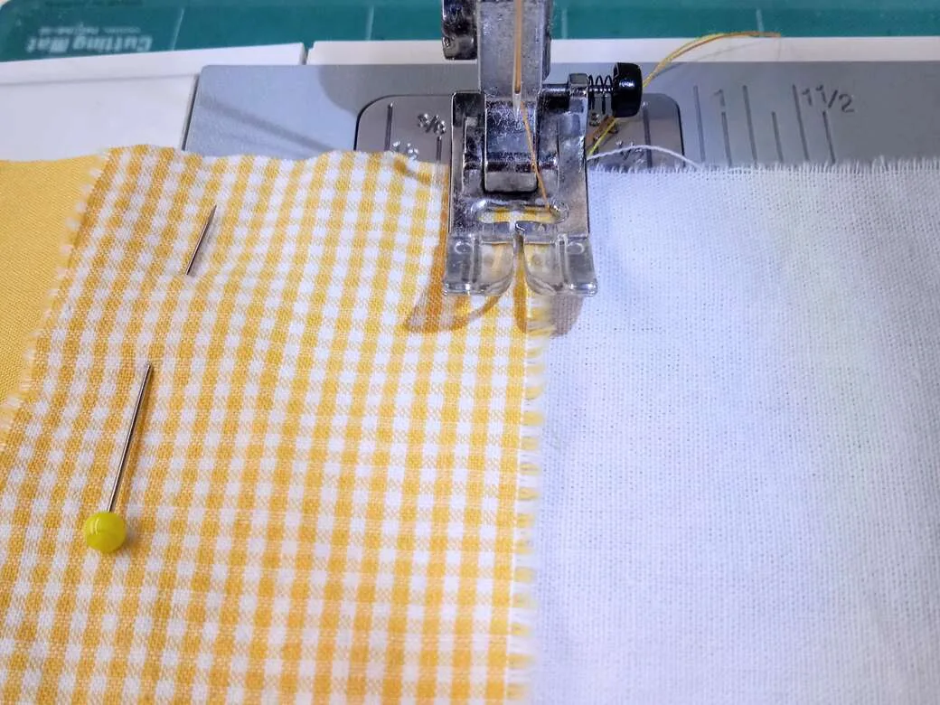 Top stitch fabric pieces together using a sewing machine.