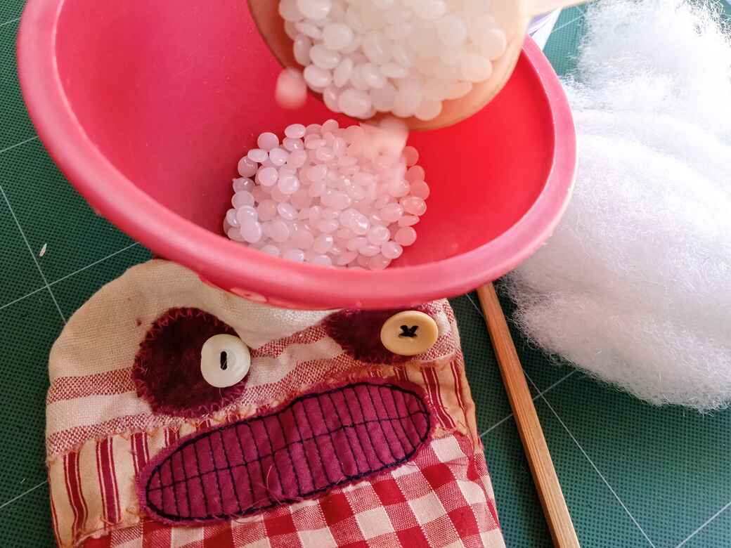 Add weight to your monster doll using plastic pellets.