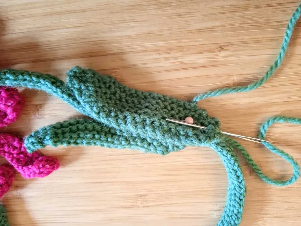 Wall Flowers, knitted flowers attach second leaf step 1.
