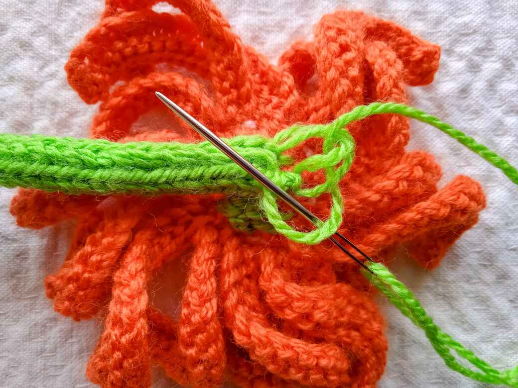 Wall Flowers, knitted flower, hanging loop step 5.