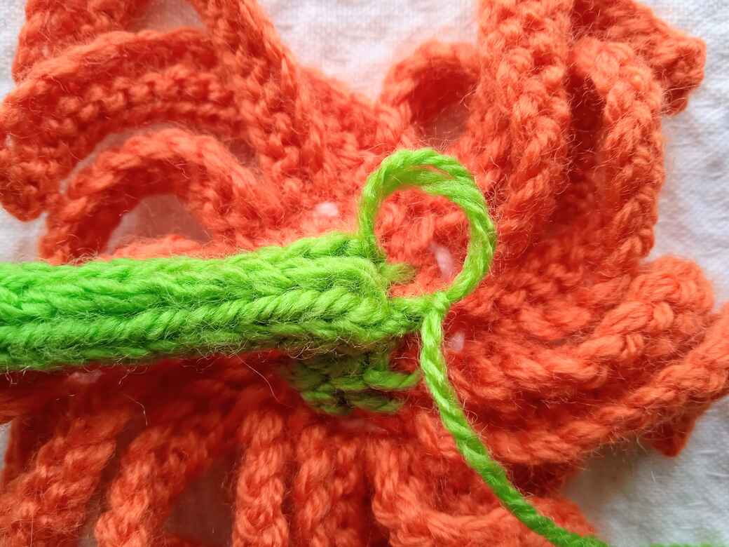 Wall Flowers, knitted flower, hanging loop step 6.
