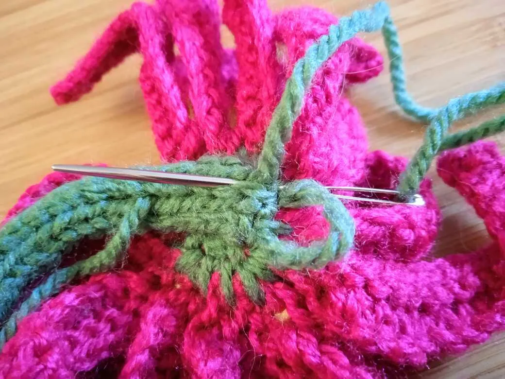 Wall Flowers, knitted flower, hanging loop step 2.