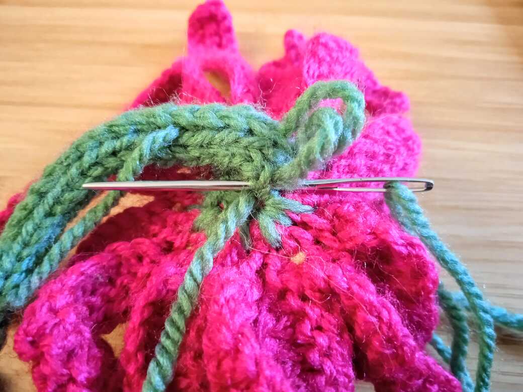 Wall Flowers, knitted flower, hanging loop step 3.