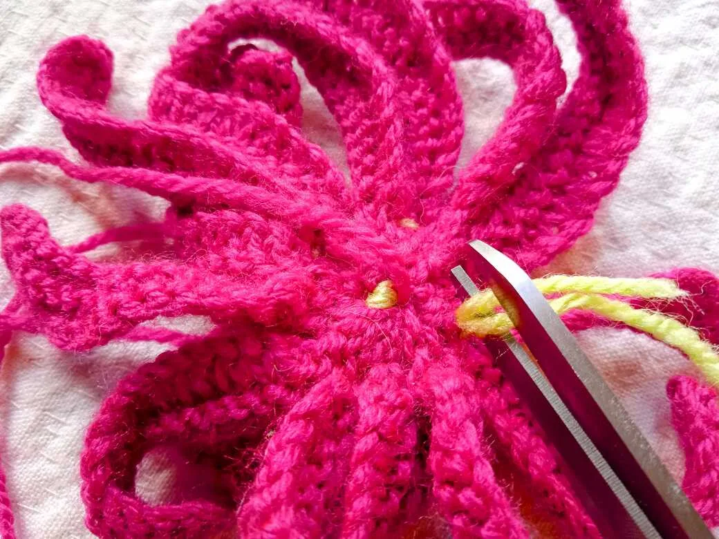 Wall Flowers, knitted flower, lose yarn ends in back of petals.